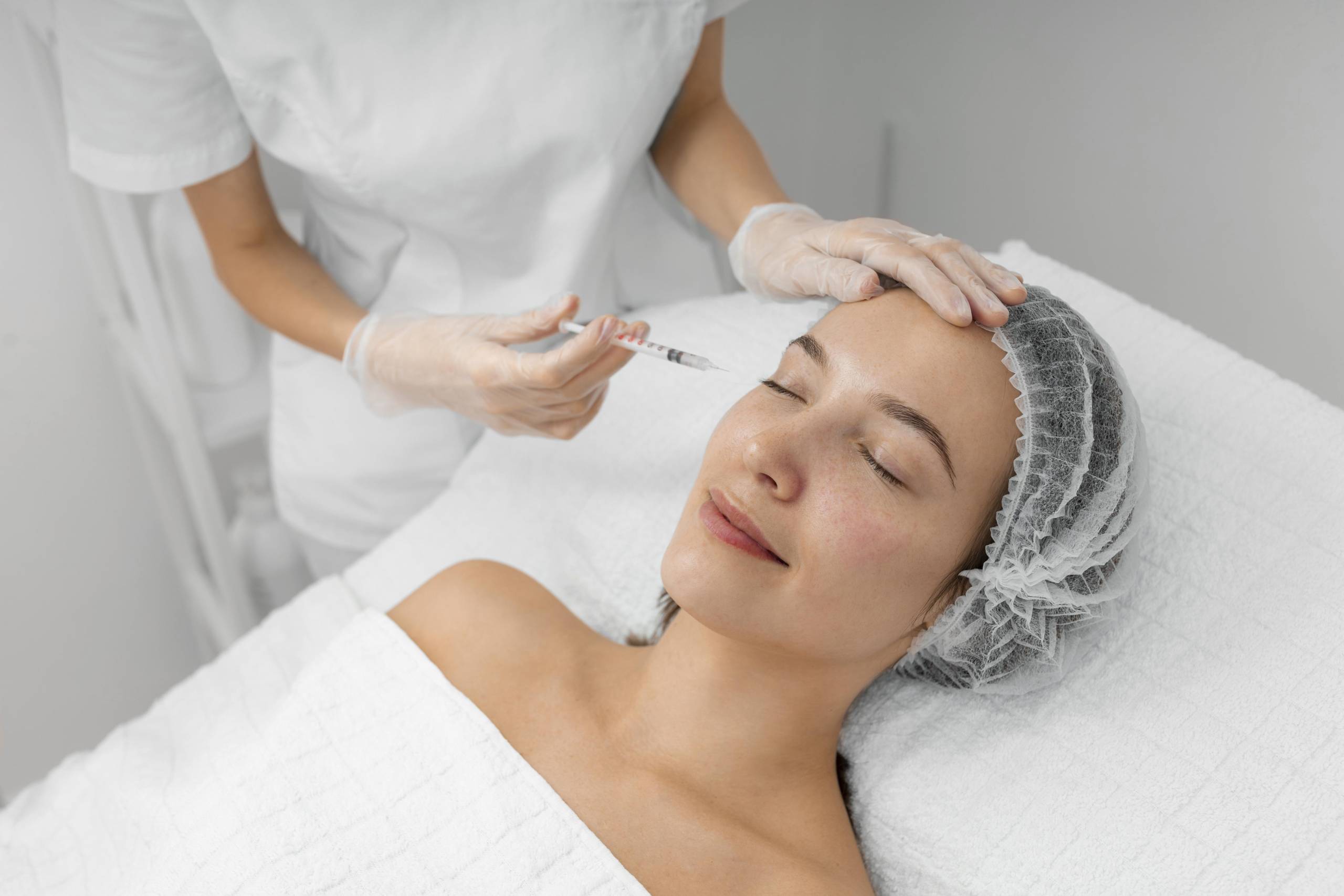beautician-doing-injection-filler-female-client-salon-1-scaled.jpg